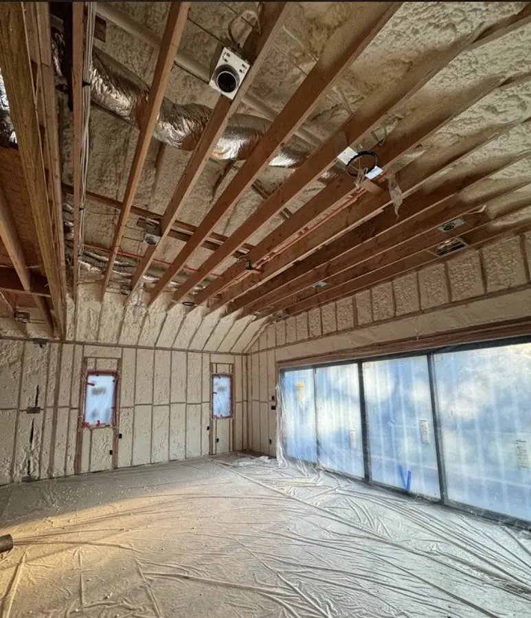 Interior walls and ceiling insulated with spray foam during new construction in Trumbull